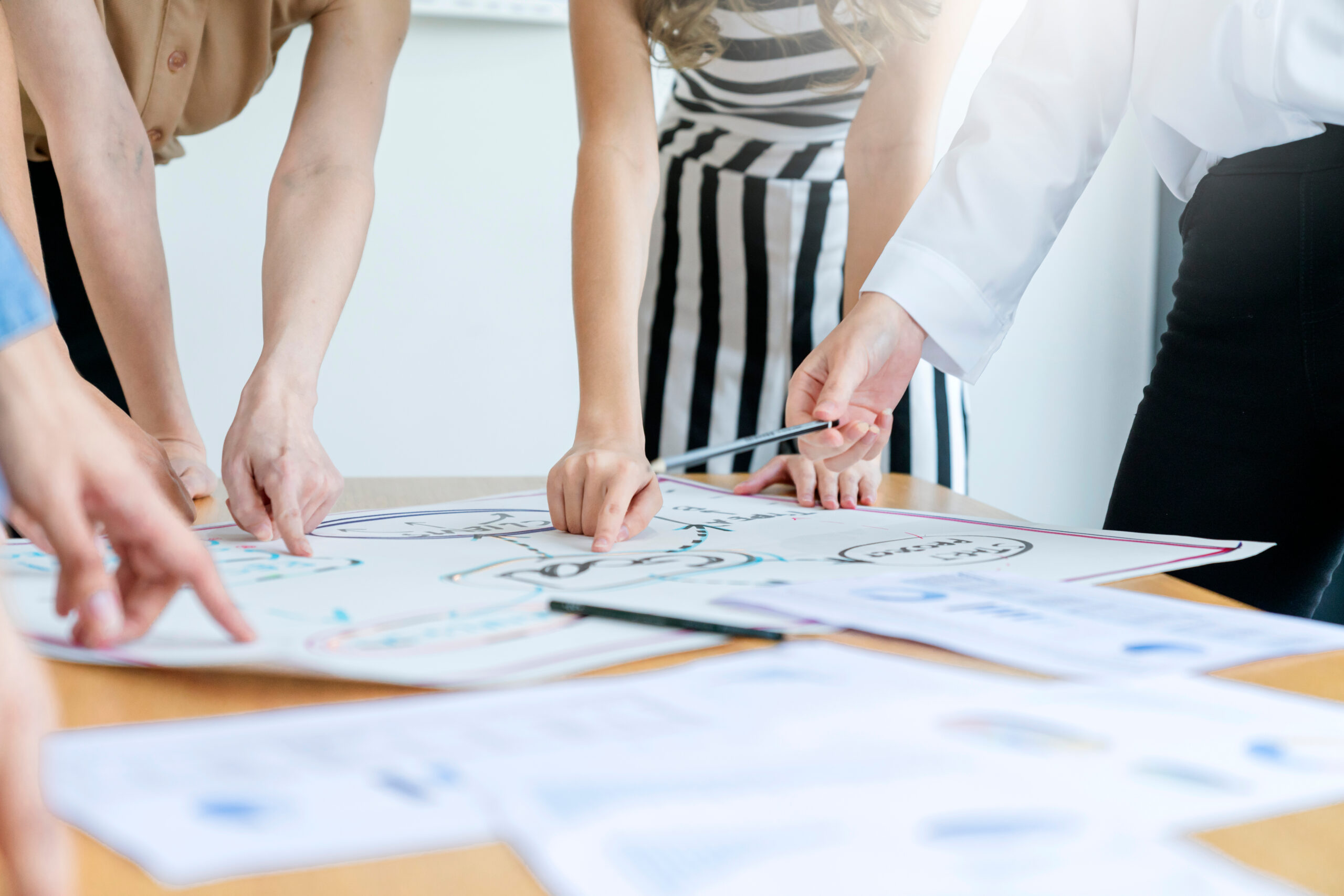 Teamwork process, business people working in the office discussing documents and ideas at meeting